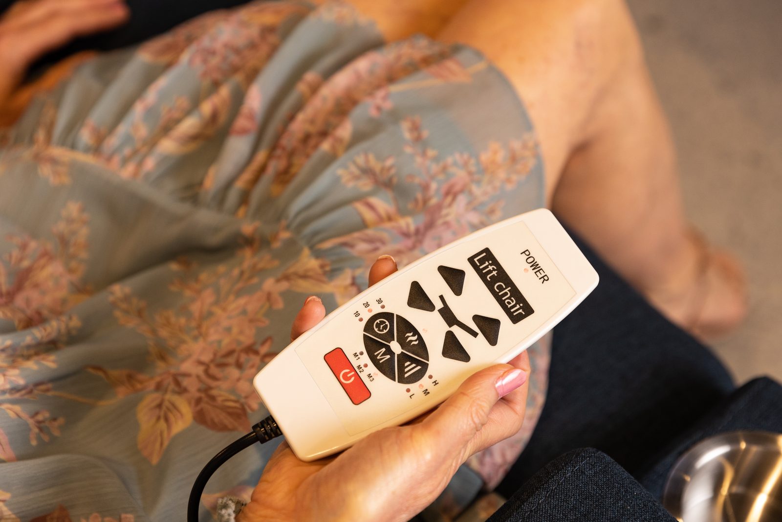Close-up of the Sophie lift recliner hand control, showing the lift, recline and massage buttons