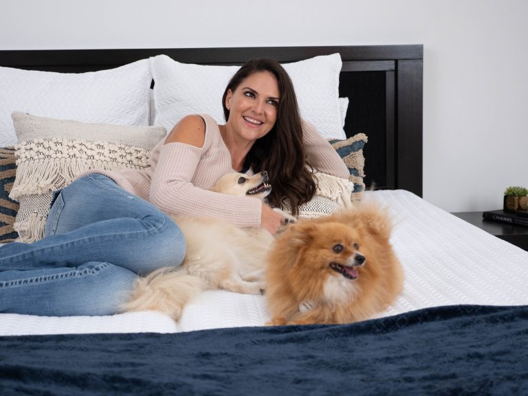 lady on sophie adjustable bed with dogs