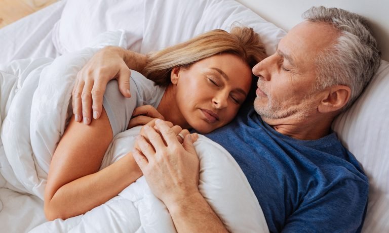 seniors laying down wife asleep