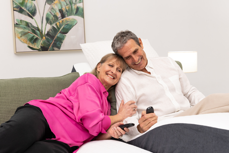 Couple laying on Split Queen Sophie Adjustable Bed